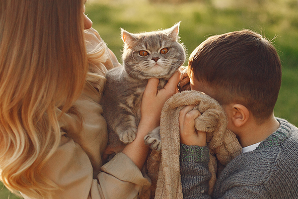 Family holding a pet
